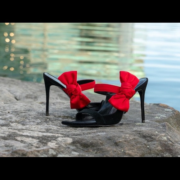 Black suede open toe mules with a red satin bow. - Picture 2 of 3